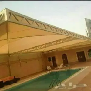 0033 انجاز الظل للمظلات والسواتر | مظلات